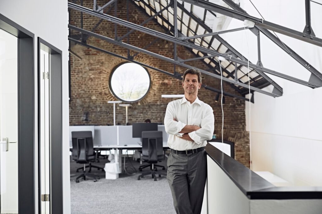 Portrait of mature businessman in modern office
