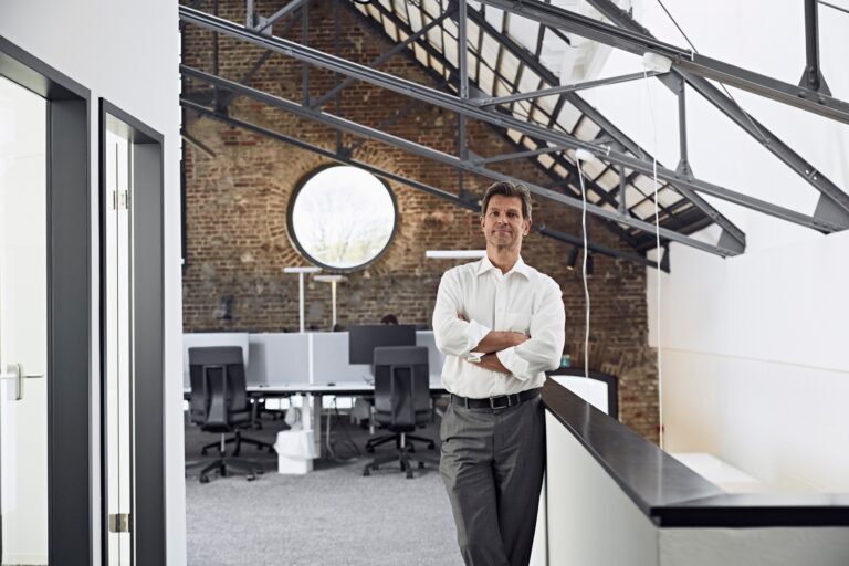 Portrait of mature businessman in modern office