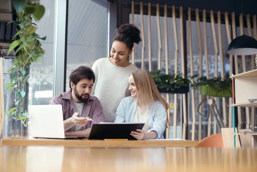 Young people coworking together at creative office sitting boss
