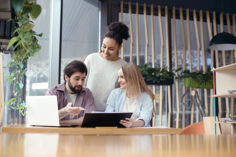 Young people coworking together at creative office sitting boss