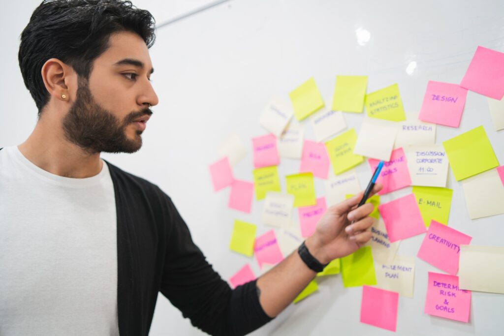Creative people meeting at office and use post it notes.