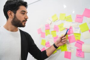 Creative people meeting at office and use post it notes.