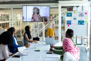 Diverse business people attending video conference at conference room
